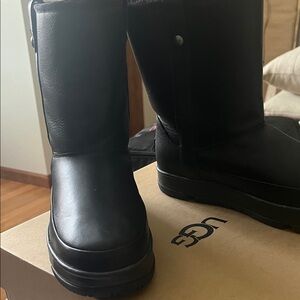 UGG Black Leather, fleece lined warm boots!  Worn once. Good traction on soles